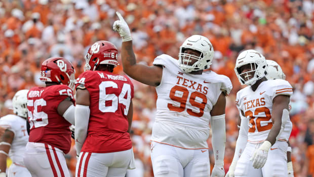 Oct 8, 2022; Dallas, Texas, USA; Texas Longhorns defensive lineman Keondre Coburn (99) reacts during the second half against the Oklahoma Sooners at the Cotton Bowl. Mandatory Credit: Kevin Jairaj-USA TODAY Sports